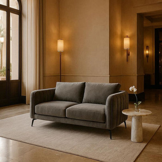 Chester sofa side view showing elegant fluted arm profile and ribbed texture in grey upholstery